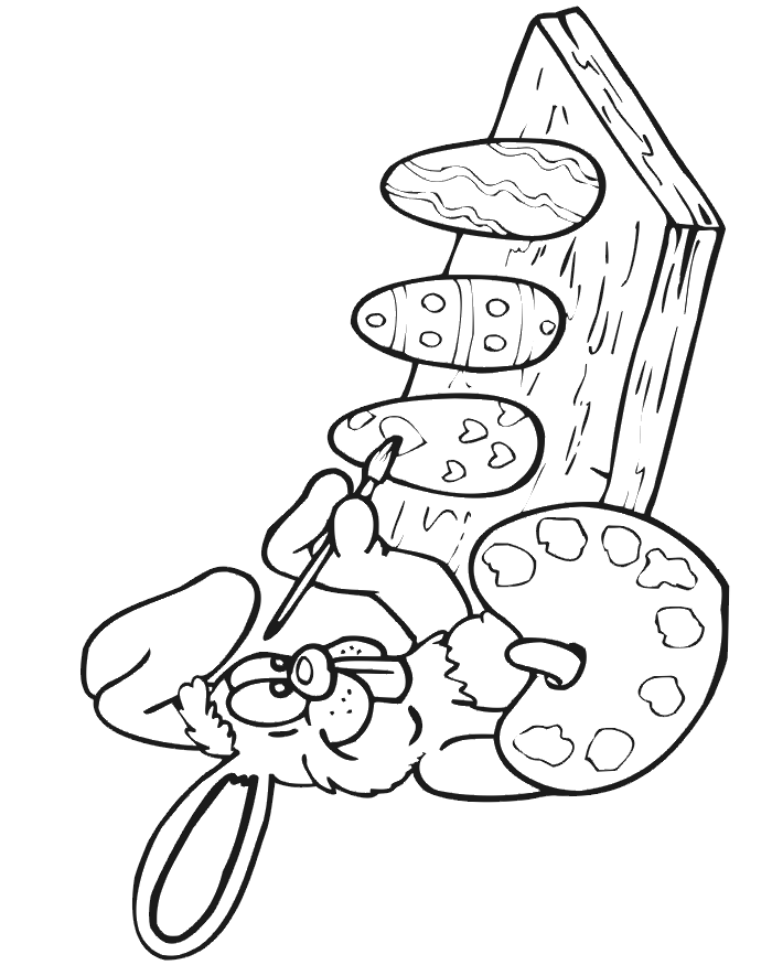 Easter coloring page of the bunny paining Easter eggs